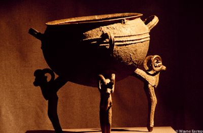 This cast copper cauldron with ram's head legs dated from the 5th to 3rd centuries B.C. it was found in 1912 in the Semirechye area. It stands 58.5 centimeters high (23 inches). It is 31.5 centimeters (12 inches) deep and 52 centimeters (20 inches) in diameter. Cauldrons such as this werer used to cook the meat of sacrificial animals, or at the start of seasonal events such as the spring festival of Nauriz. Central State Museum, Almaty, Kazkhstan