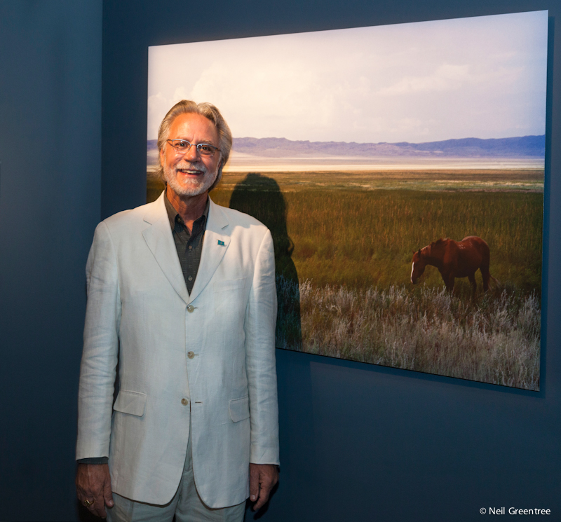 Documentary Photographer Wayne Eastep with his print at the Arthur Sackler gallery at the Smithsonian in Washington, D.C.