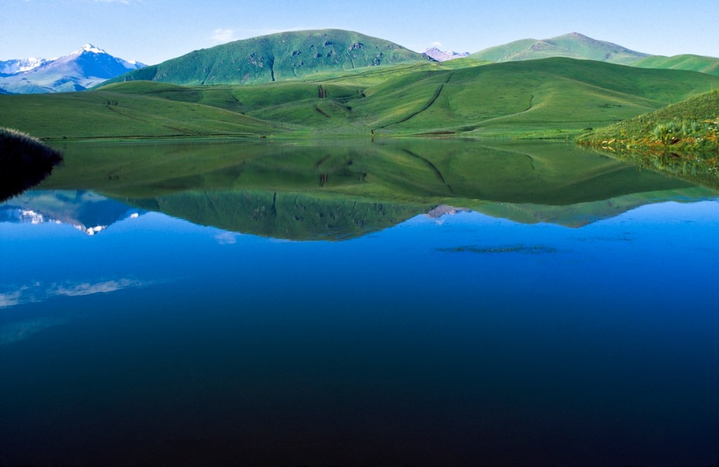 Kazakhstan is dotted with 48,000 lakes, many small like this mirror-surfaced one at Ush-Konyr near Fabrichny